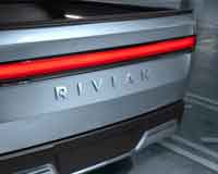 Фото логотипа (эмблемы, знака, фирменной надписи) легковых автомобилей марки Rivian «Ривиан»